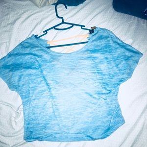Blue crop top with open back orange cross strings